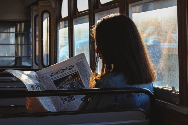 Women reading newspaper