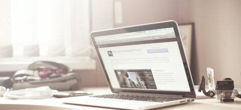 black and gray laptop computer on writing desk