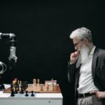 elderly man thinking while looking at a chessboard