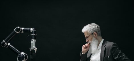 elderly man thinking while looking at a chessboard